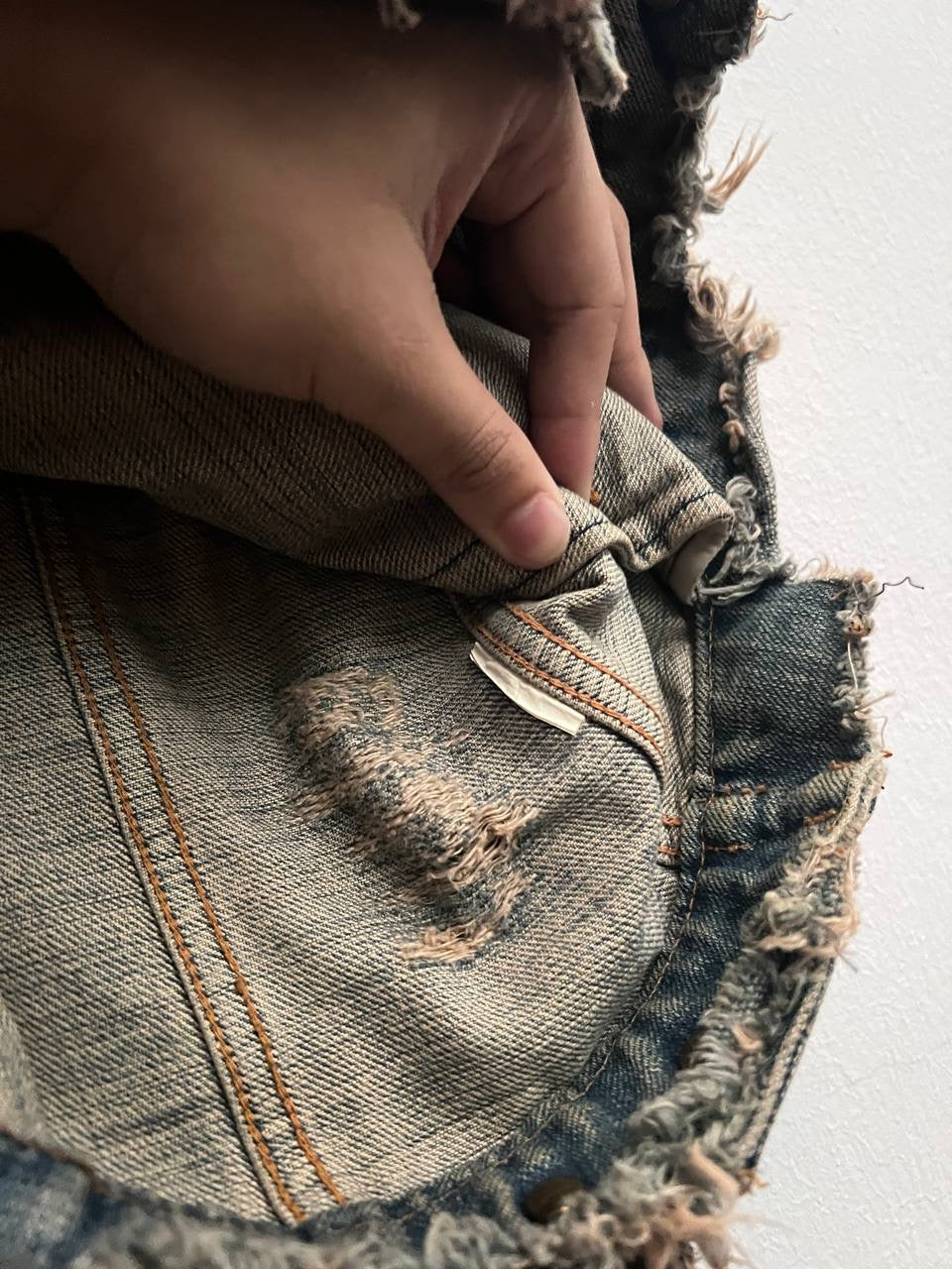 Le Grand Bleu Distressed Denim Jacket